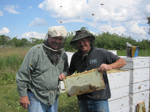 John and Kenny with some of their friendly bees